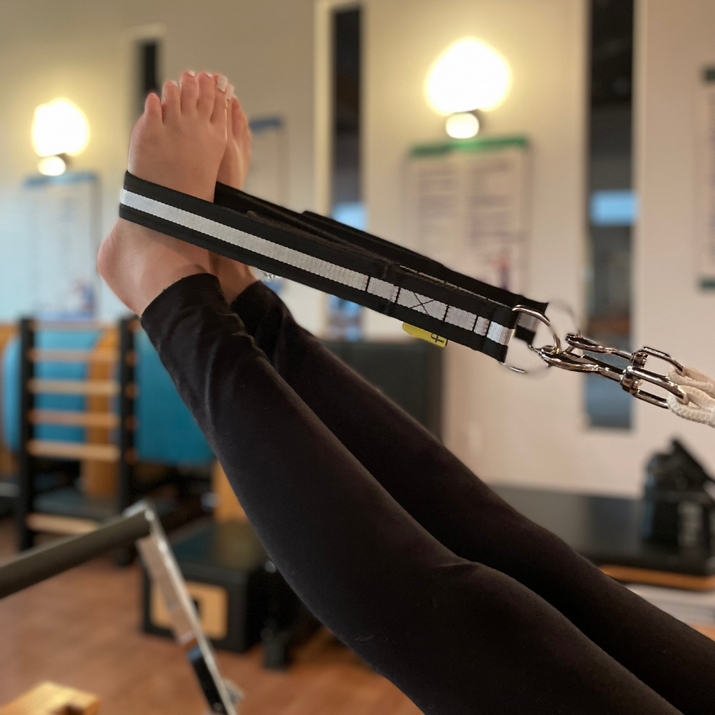 feet in straps with double loops