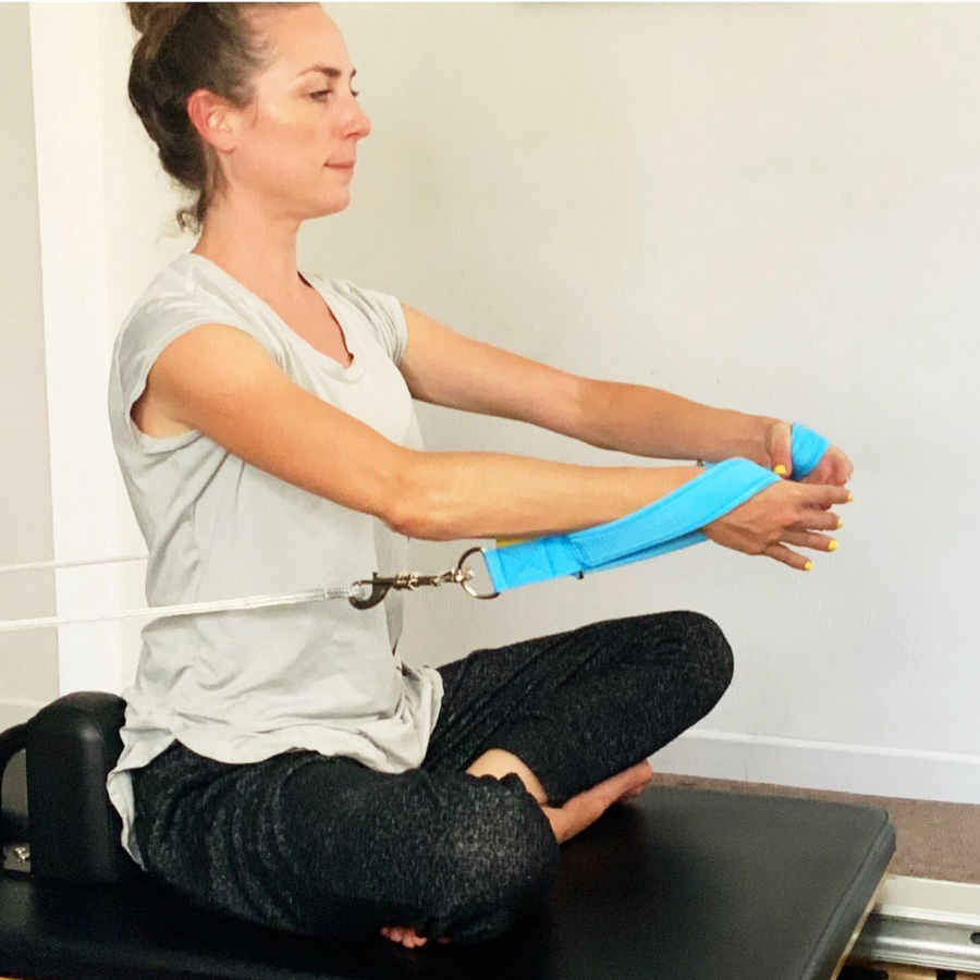 hug a tree on the reformer with blue padded pilates loops